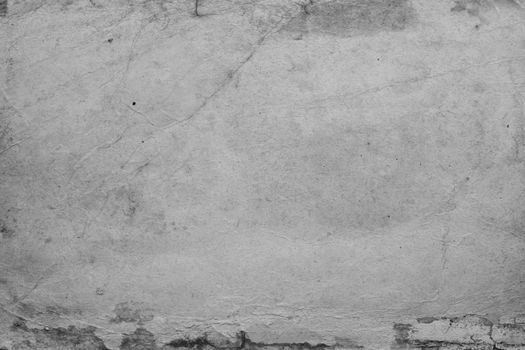 A plain piece of grey paper with a worn surface