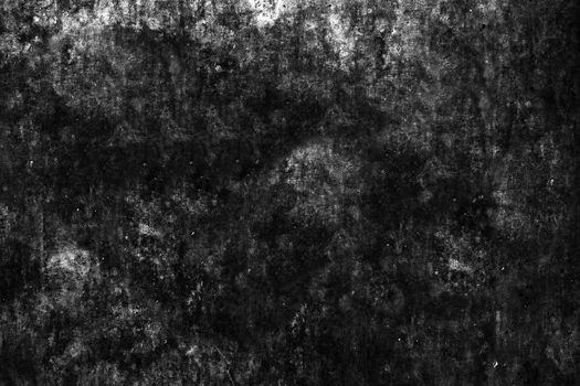 The black concrete wall of a dirty dark color