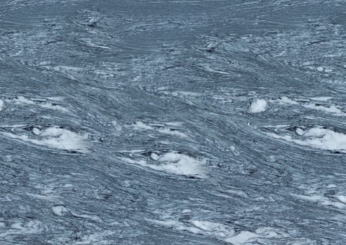 Textured smooth grey marble floor with white streaks