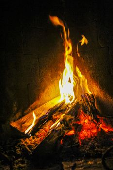 Romantic bright open fire on wood in a hut in beautiful Norway.