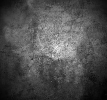 The scratched textured surface of the metal base is grey . Texture or background.