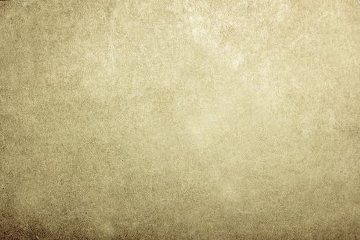 Time-aged parchment paper of grey-green color with a textured surface .Texture or background