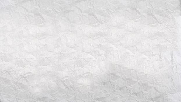 A crumpled sheet of white paper with a textured surface .Texture or background