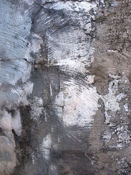The wall of an old abandoned building aged by time . Texture or background