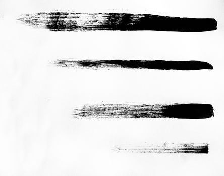 A set of black marker paint strokes isolated on a white background. Texture or background