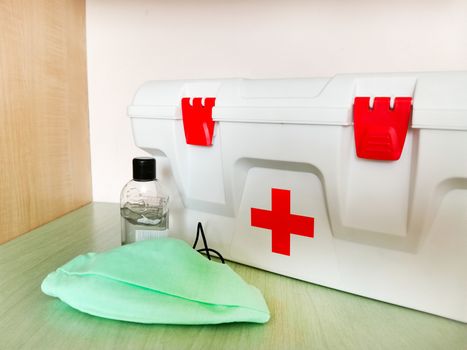 Disinfectant and home first aid kit with a protective face mask against flu viruses .Texture or background