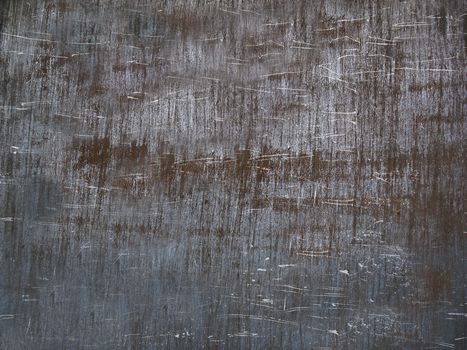 The scratched rusty metal surface is gray .Background or texture