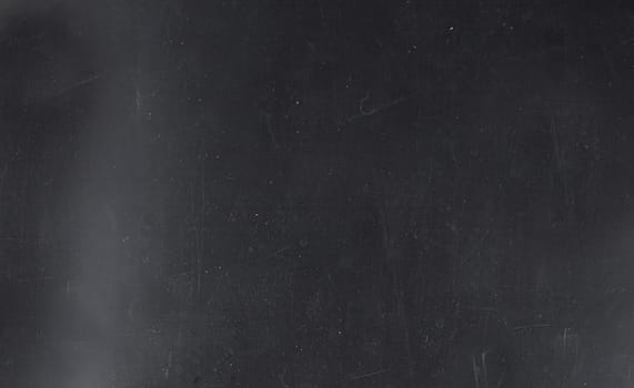 Grunge on a dark blue background with scratches and lint on the surface.Texture or background