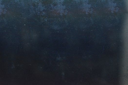 Grunge on a dark gray background with scratches and roughness on the surface
