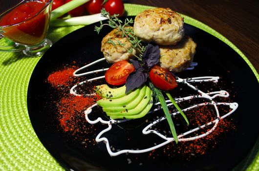 A beautifully designed homemade dish of cutlets with seasoning and herbs