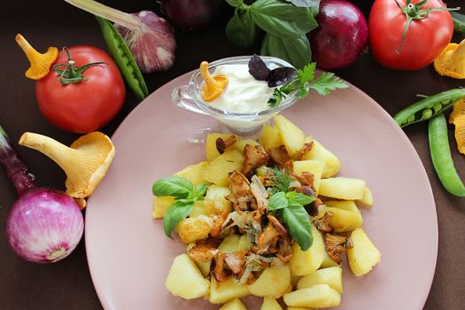 Slavic dish close up fried mushrooms with potatoes in a rustic way