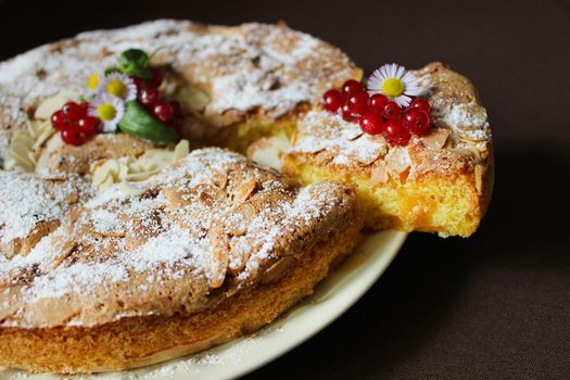 On a plate of Apple pie with nuts and red currants.Texture or background
