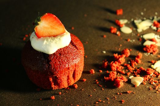 The prepared cake is decorated with a strawberry slice and .Texture or background