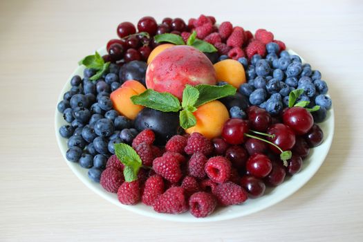 Different types of fresh fruit on a white background.Texture or background