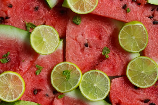 Lime slices with mint and slices of ripe watermelon.Texture or background
