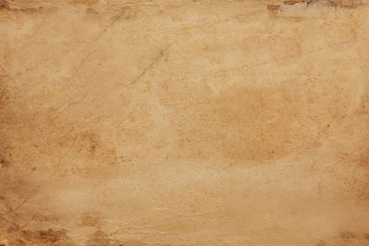 Paper aged by time with spots and scuffs on the surface .Texture or background