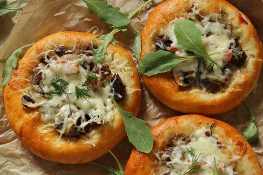 Homemade fresh pastries with meat and mushrooms and decorated with cheese .Texture or background