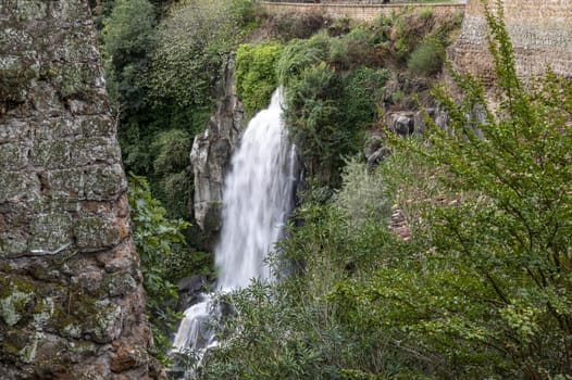 the waterfall of nepi surrounded by greenery in provoncia di rome