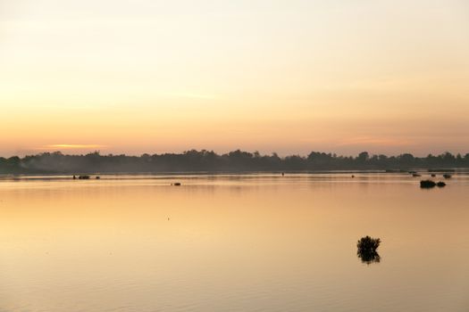 Muong Khong Laos 1/12/2012 Mekong river at dawn with golden sun and traditional fishing boats with nets . High quality photo