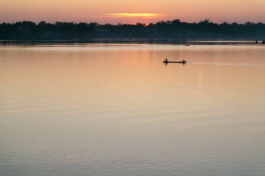 Muong Khong Laos 1/12/2012 Mekong river at dawn with golden sun and traditional fishing boats with nets . High quality photo