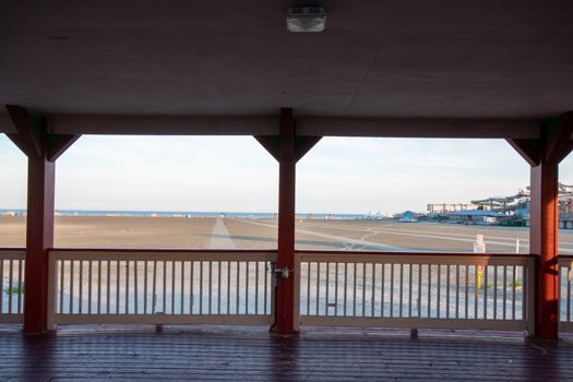 Standing Under a Pavillion on the Wildwood Boardwalk Looking Out at the Beach