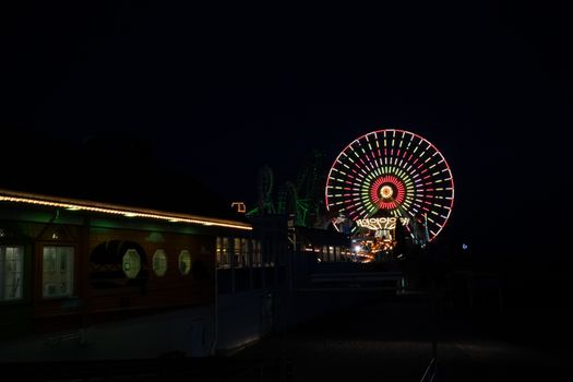 An Amusement Park Pier in Wildwood New Jersey Lit Up By Lights on the Rides at Night