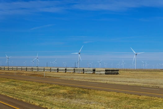 A wind turbine farm in rural West Texas on highway
