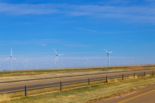 Wind generators at electric farm on Texas along with wind energy