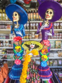 Papier mache figurines of La Catrina, evocative of Mexican culture and the Day of the Dead celebrations, make popular ornaments during the halloween and Dia de Muertos holidays
