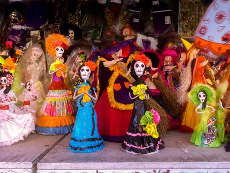 Papier mache figurines of La Catrina, evocative of Mexican culture and the Day of the Dead celebrations, make popular ornaments during the halloween and Dia de Muertos holidays