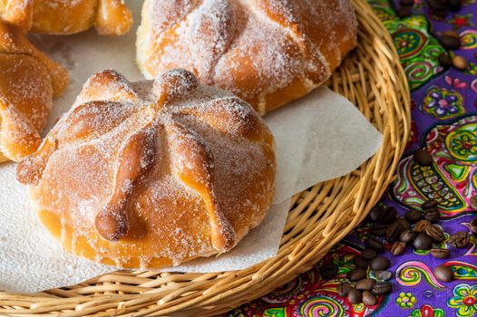 Traditional Mexican bread of the dead pan de muerto served with coffee from the pot cafe de olla, this bread is made around the day of the dead celebration and is often left on altars of remembrance