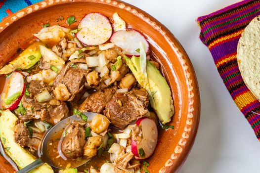 Red pozole, a traditional Mexican stew made with pork and hominy corn. In the Aztec heyday, this dish was made with human meat but the Spaniards ended the practice