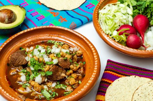 Red pozole, a traditional Mexican stew made with pork and hominy corn. In the Aztec heyday, this dish was made with human meat but the Spaniards ended the practice