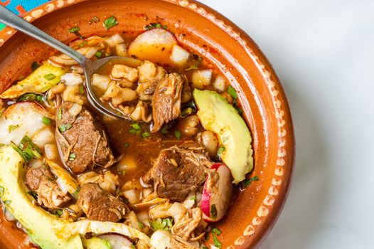 Red pozole, a traditional Mexican stew made with pork and hominy corn. In the Aztec heyday, this dish was made with human meat but the Spaniards ended the practice