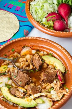 Red pozole, a traditional Mexican stew made with pork and hominy corn. In the Aztec heyday, this dish was made with human meat but the Spaniards ended the practice