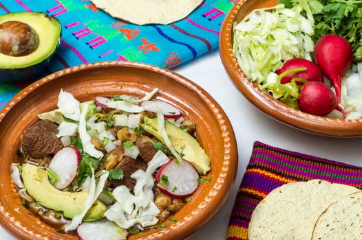 Red pozole, a traditional Mexican stew made with pork and hominy corn. In the Aztec heyday, this dish was made with human meat but the Spaniards ended the practice