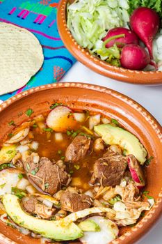 Red pozole, a traditional Mexican stew made with pork and hominy corn. In the Aztec heyday, this dish was made with human meat but the Spaniards ended the practice