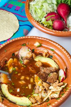 Red pozole, a traditional Mexican stew made with pork and hominy corn. In the Aztec heyday, this dish was made with human meat but the Spaniards ended the practice