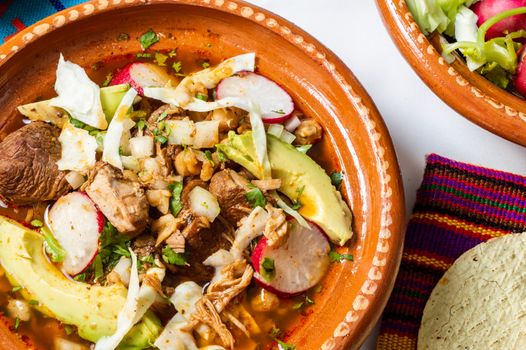 Red pozole, a traditional Mexican stew made with pork and hominy corn. In the Aztec heyday, this dish was made with human meat but the Spaniards ended the practice