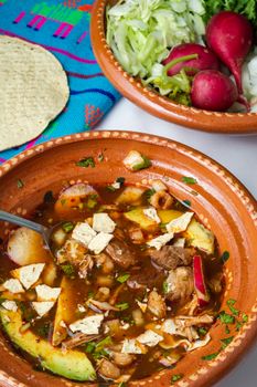 Red pozole, a traditional Mexican stew made with pork and hominy corn. In the Aztec heyday, this dish was made with human meat but the Spaniards ended the practice