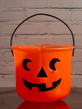 Carved pumpkin shaped candy basket, decorations for the halloween party