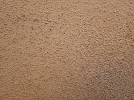 Brown plaster walls. The background of painted wall.