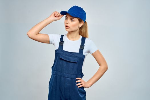 Woman in working uniform blue cap service lifestyle service. High quality photo