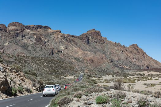 Tenerife island, Spain - 05/10/2018: a String of cars rides on a mountain road
