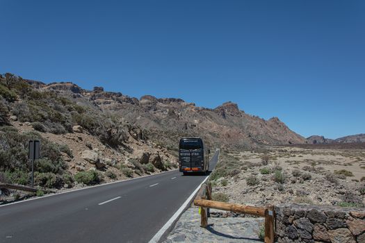 Tenerife island, Spain - 05/10/2018: Tourist bus rides moving on a mountain road
