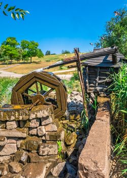 Zaporozhye, Ukraine 07.21.2020. Water Mill in Voznesenovsky park in Zaporozhye, Ukraine, on a sunny summer morning