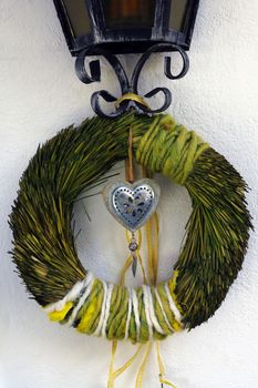 Beautiful wreath on the front door lamp