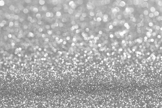 Shiny silver bokeh glitter lights abstract background, Christmas New Year party celebration concept