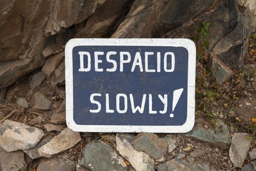 Ollantaytambo, Peru - April 4, 2014: Warning sign on the trail towards the Inca remains of Pinkuylluna, Ollantaytambo Archaeological Site, Peru.