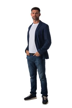 Full length portrait of mid adult serious business man in jeans and blue blazer isolated on white background, casual people